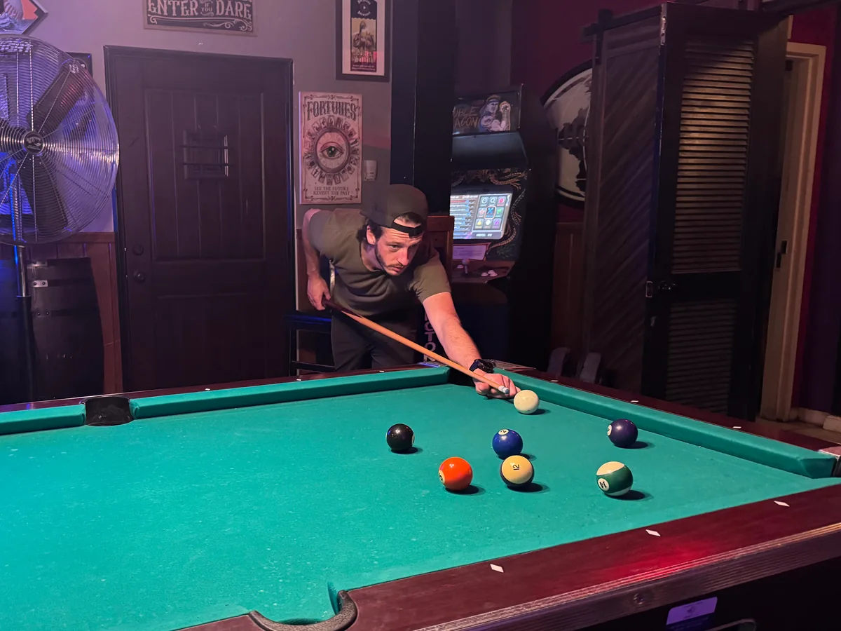 Lining up a shot during a game of pool